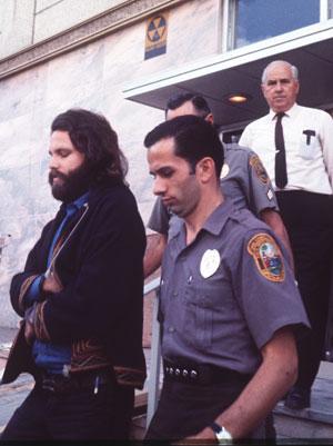 Jim Morrison being led to Dade County Jail in Miami 9-20-1970.
